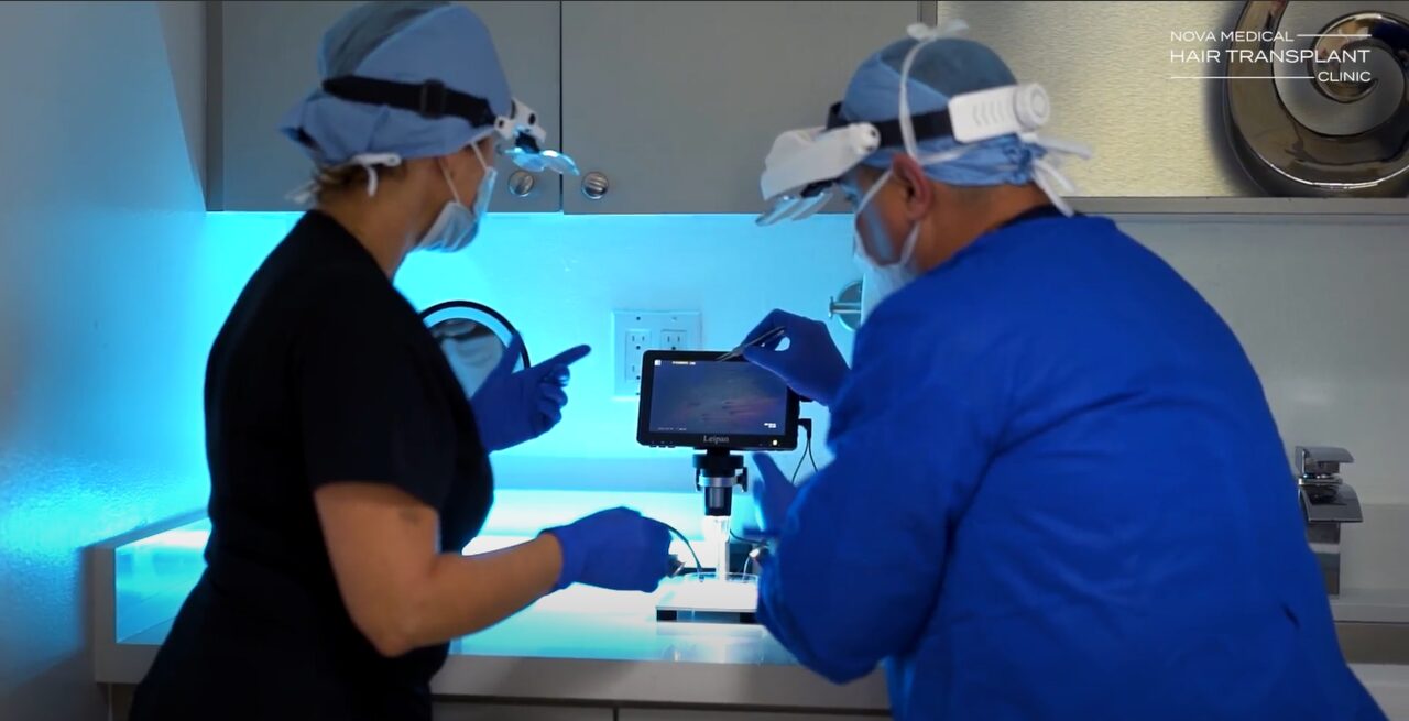 Nova Medical Miami team checking grafts under a digital microscope